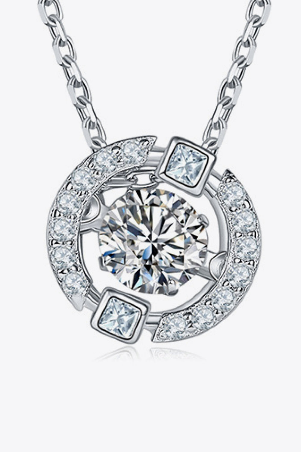 Silver necklace with round moissanite and square accent stones in a celestial design.