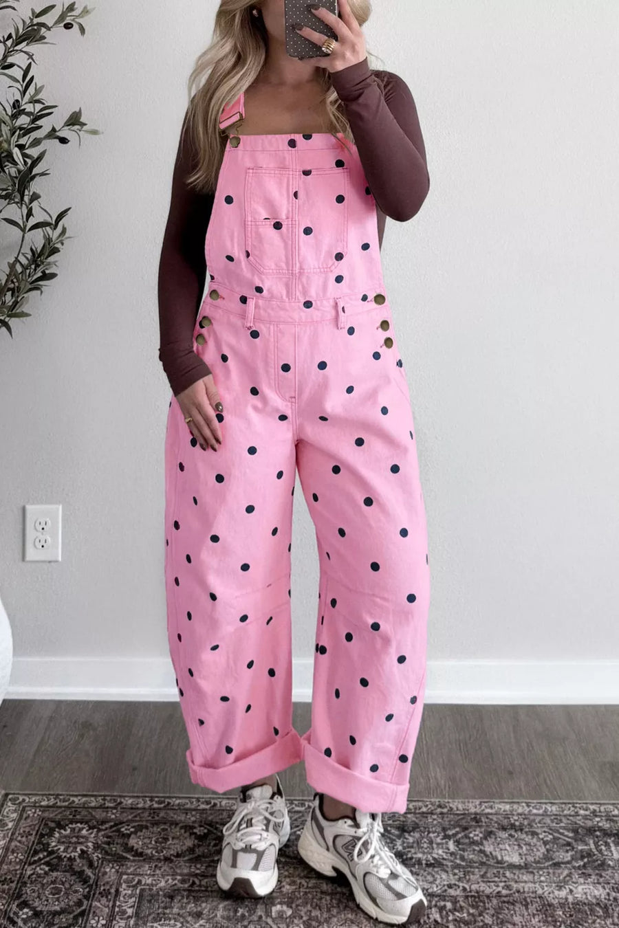 Pink polka dot denim overalls with bib pocket and button side detail