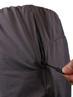 Dark Gray Gymbull performance shorts with zippered pocket detail