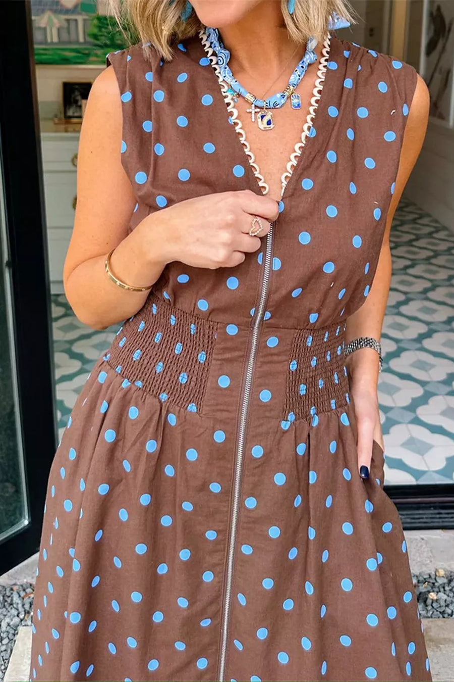 Brown polka dot midi dress with smocked waist and zipper detail