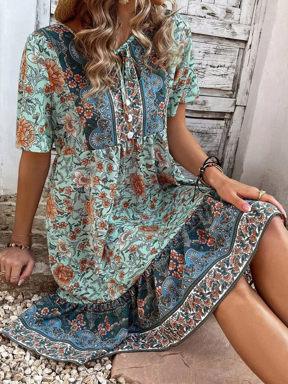 100% polyester Care instructions: Machine wash cold mini dress in teal blue with A-line silhouette