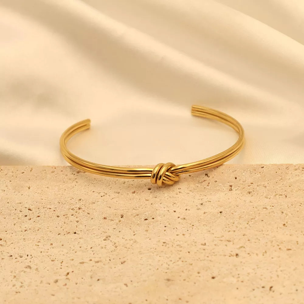 18K Gold-Plated,Stainless Steel Care instructions: Avoid wearing during exercise bracelet in Gold with open cuff silhouette