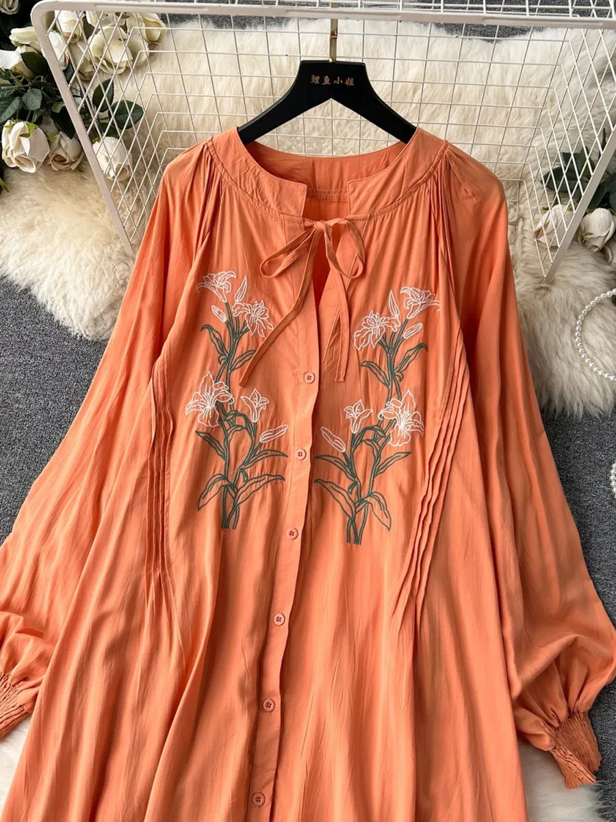 Orange embroidered floral maxi dress with tie neck and button front