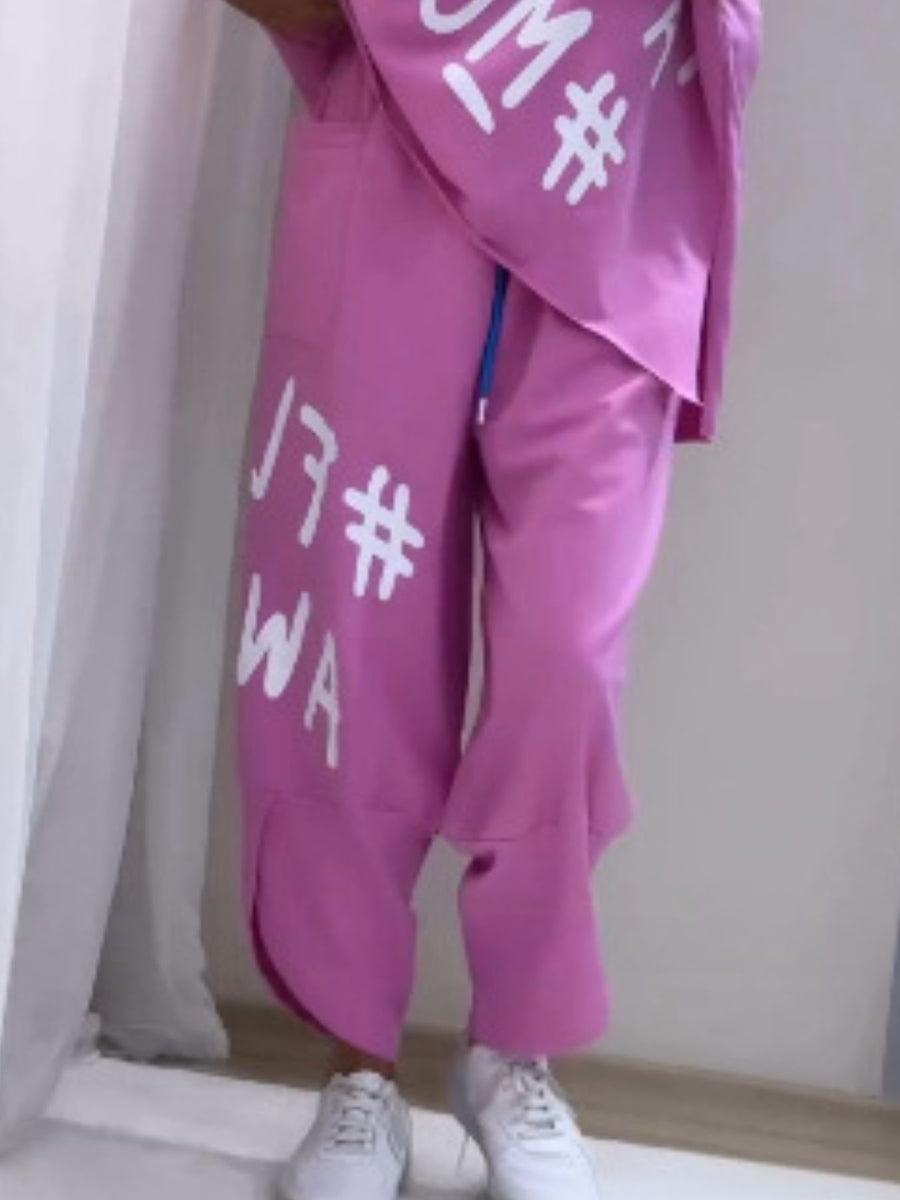 Purple graphic tee and drawstring pants set with white lettering and blue drawstring