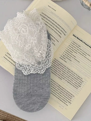 ivory socks featuring lace trim and lace