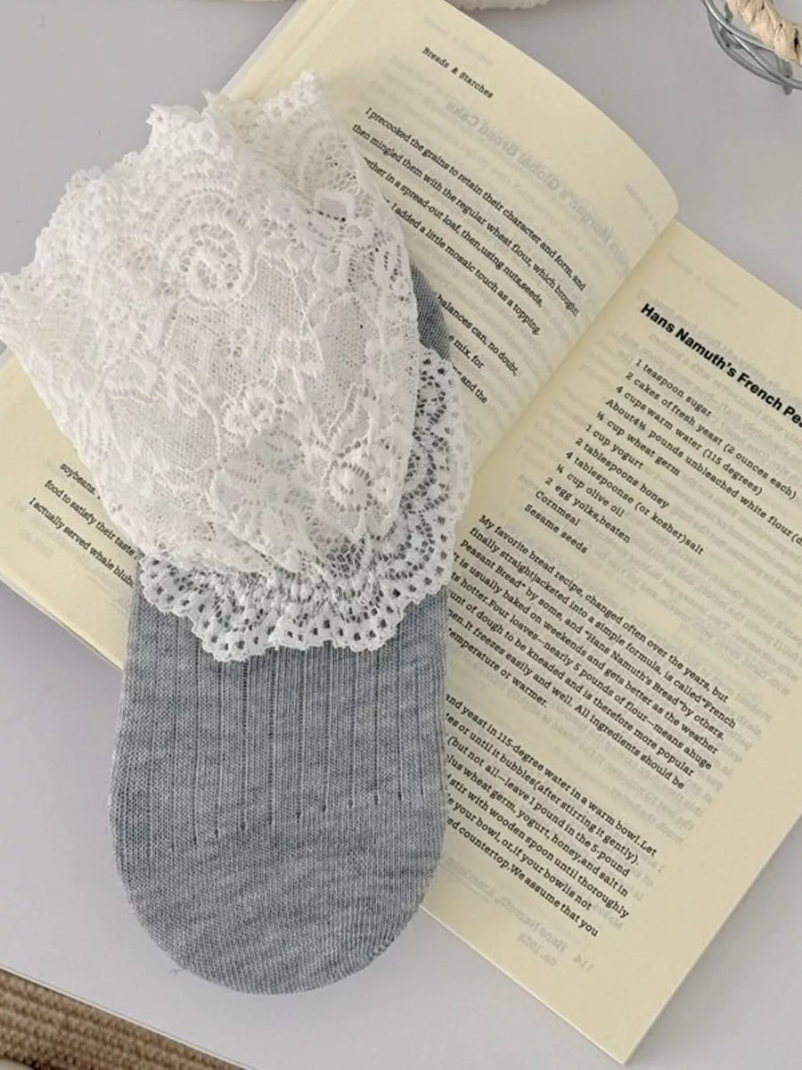 ivory socks featuring lace trim and lace