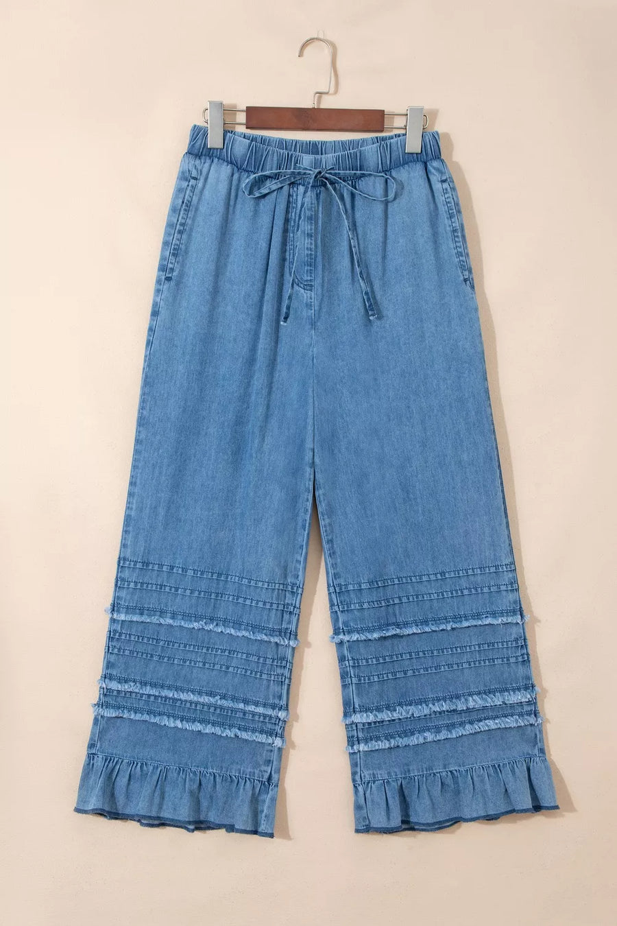 Maternity wide-leg chambray jeans with drawstring and ruffled hem detail.