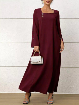 Maroon maxi dress with square neck, flare sleeves, and decorative buttons on sleeves and neckline.