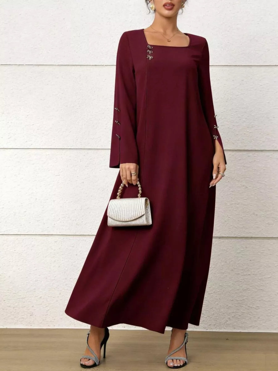 Maroon maxi dress with square neck, flare sleeves, and decorative buttons on sleeves and neckline.