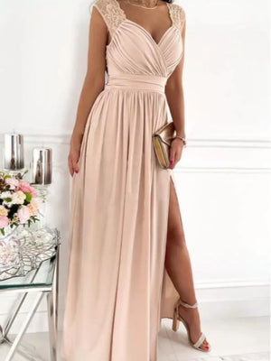 Elegant tan maxi dress with lace shoulder accents and high slit.