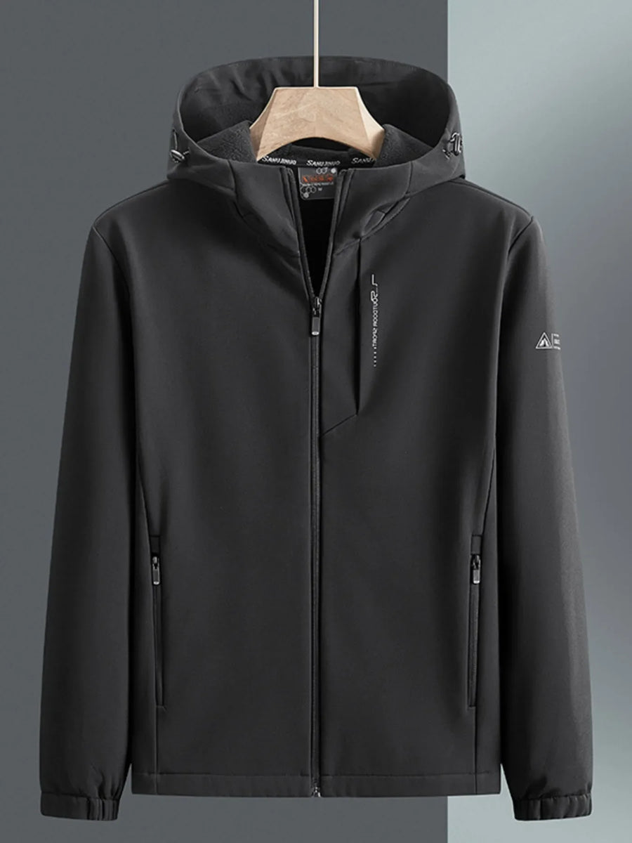 Men's black hooded windbreaker jacket with zippered pockets and subtle chest logo detail.