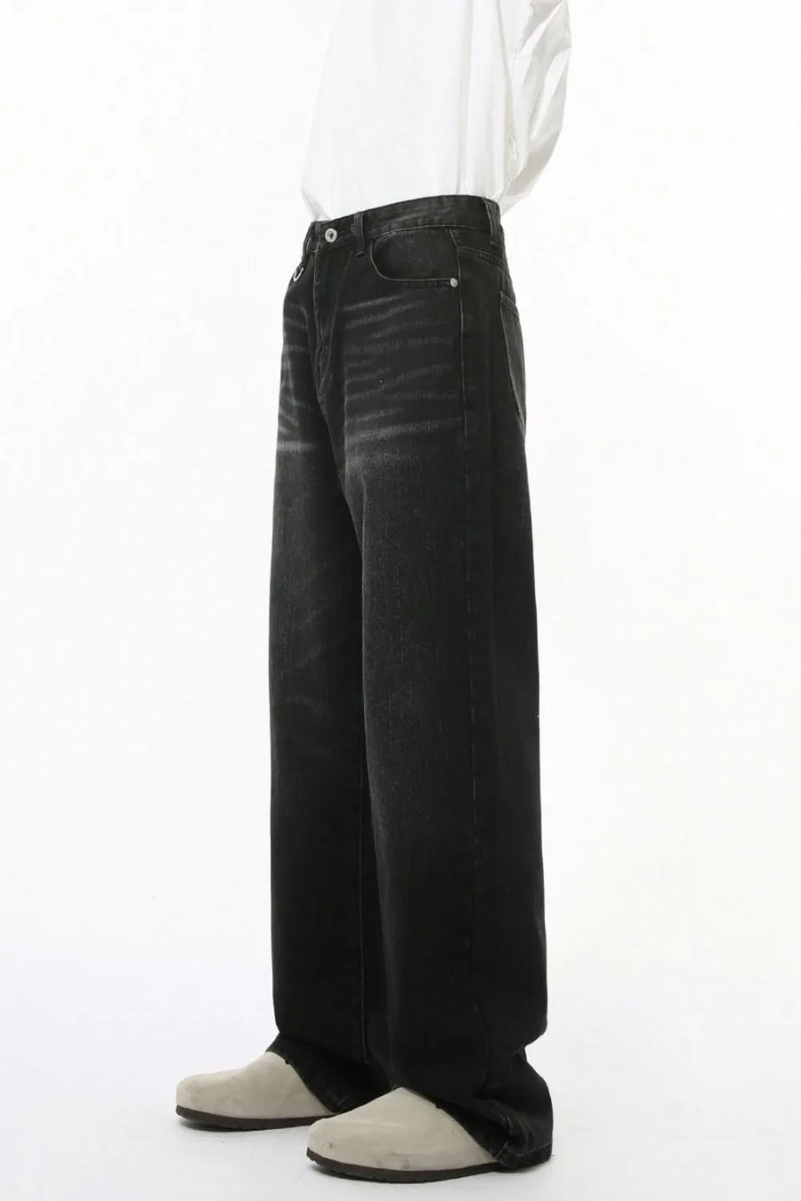 Dark wash wide leg denim jeans with statement pockets and a relaxed fit.
