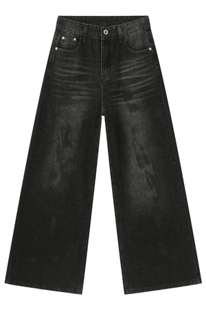 Oversized charcoal wash denim jeans with a wide leg and distressed detailing.