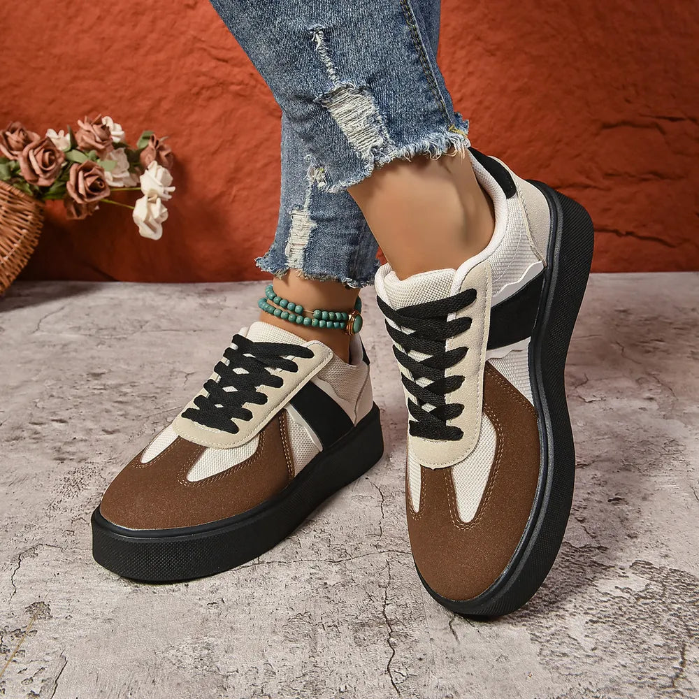 Panelled platform sneakers with contrast brown, beige and black accents and black laces.