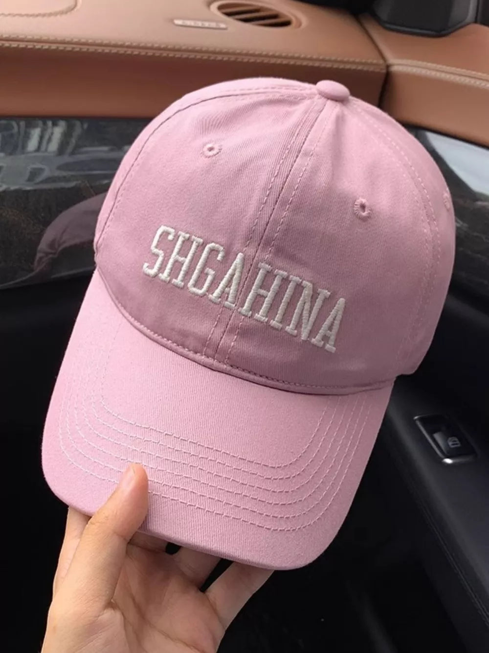 Pink cotton baseball cap with white mirrored letter embroidery and curved brim