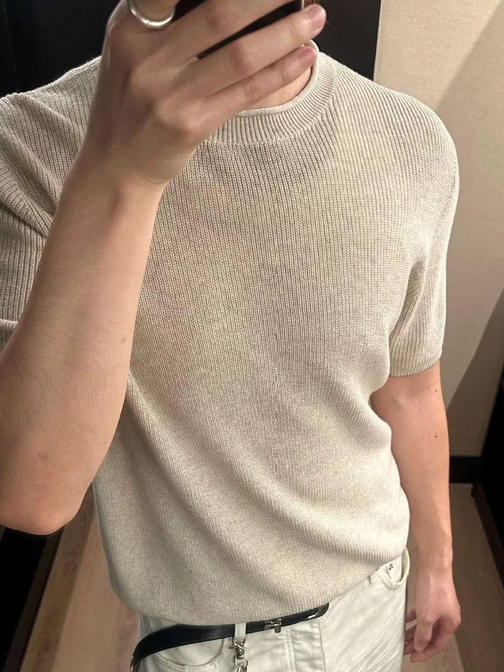 Men's beige short sleeve knit top with crew neck and ribbed texture.