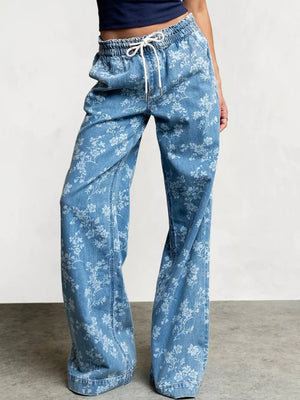 wide-leg jeans in light blue featuring drawstring waist and flared fit