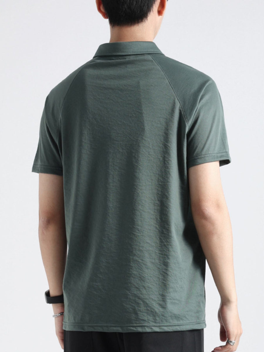 Dark green cotton blend polo shirt with short sleeves and a classic collar, shown from the back.