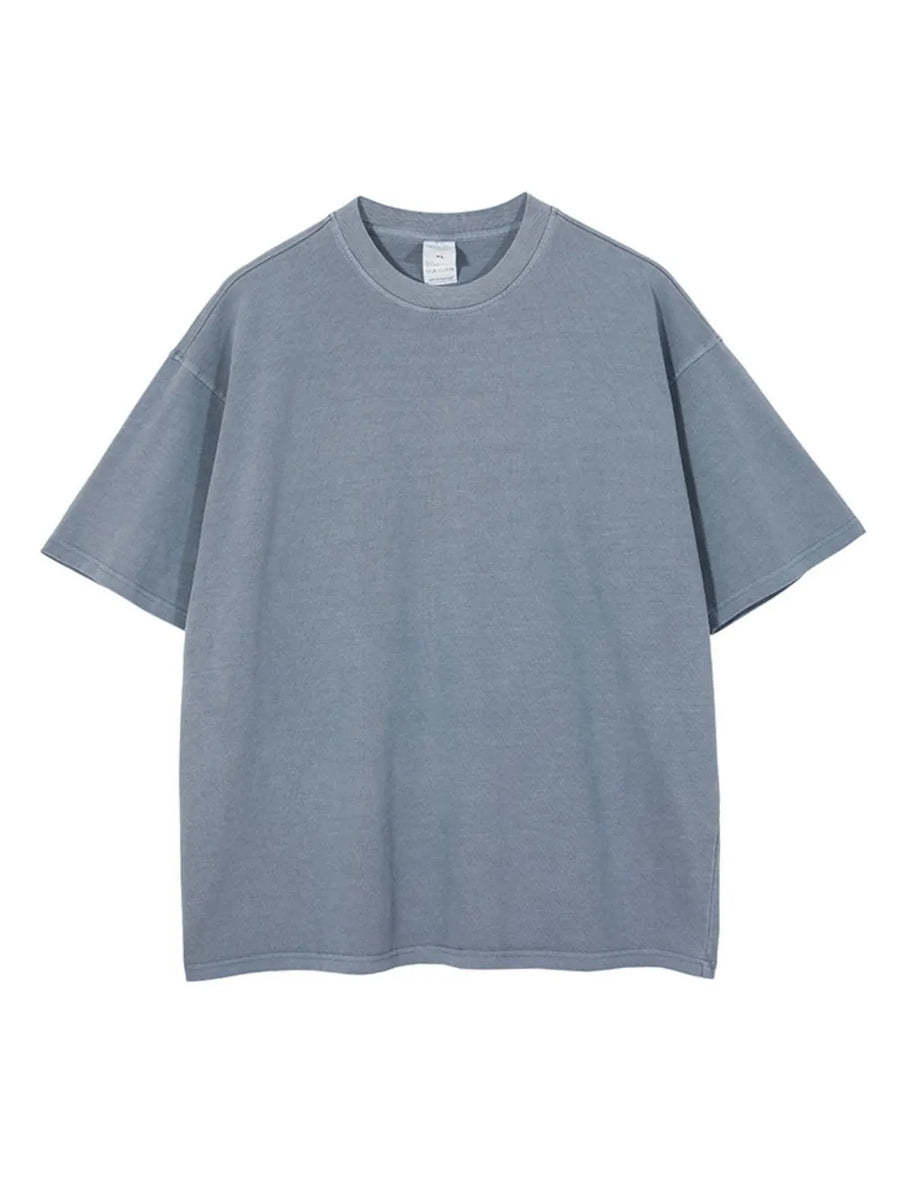 Oversized washed cotton tee in Dusty Blue with relaxed fit and crew neck.