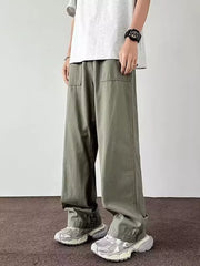 Men's green wide-leg cargo pants with front pockets and casual styling.