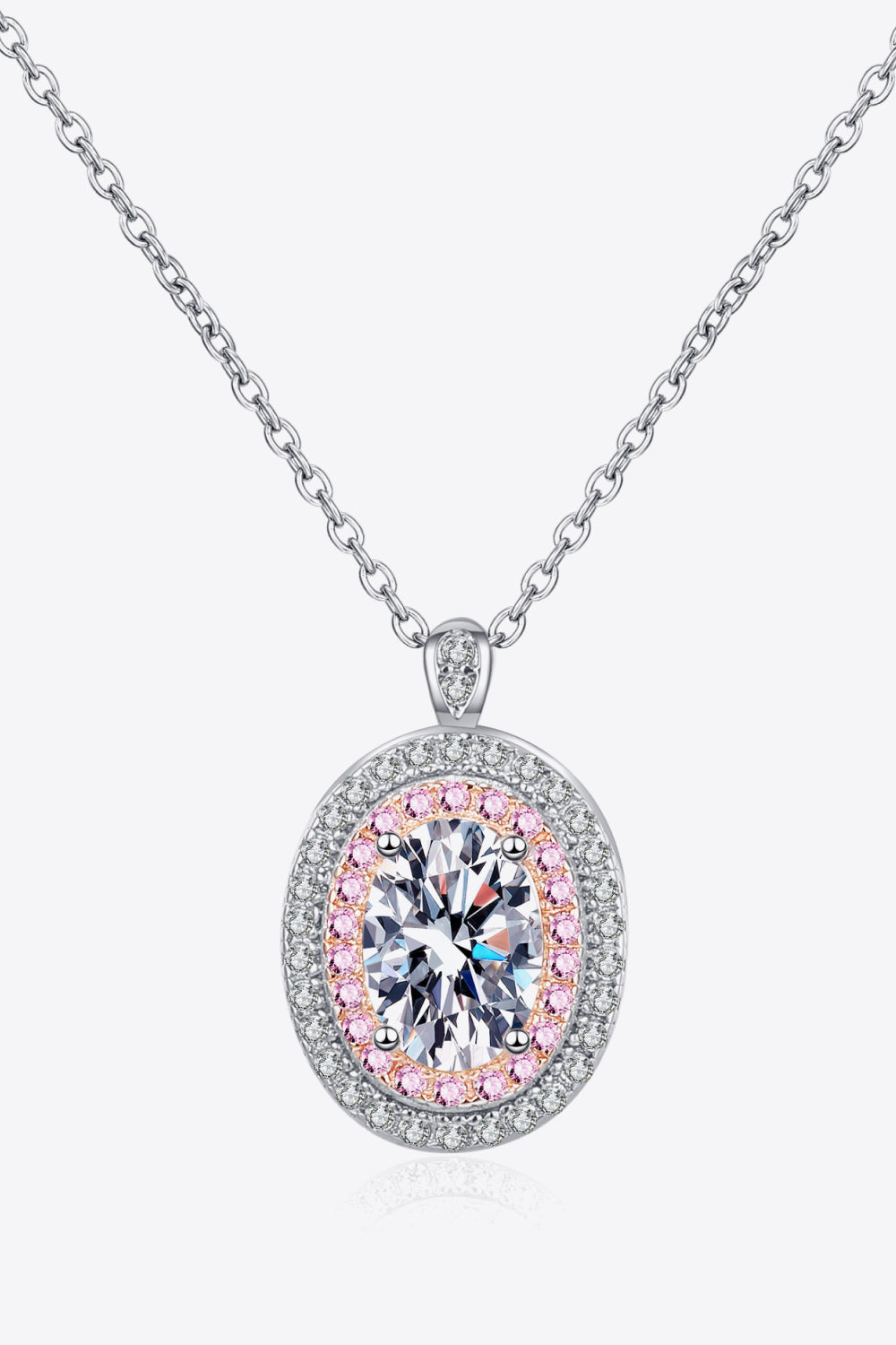 Silver halo moissanite pendant necklace with oval center stone and pink accent stones.