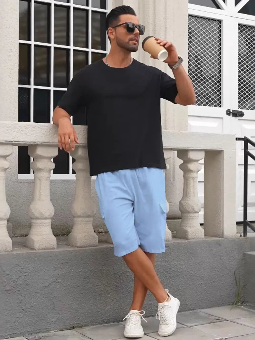 Light blue relaxed fit drawstring shorts with utility pockets.