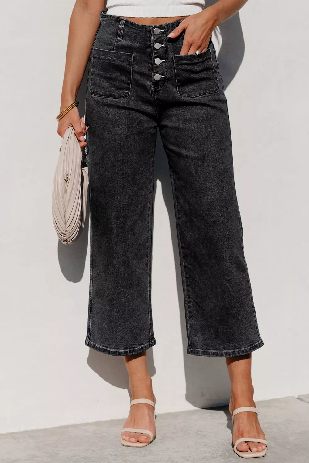 Wide-leg denim jeans in charcoal wash with button-fly and utility pockets.