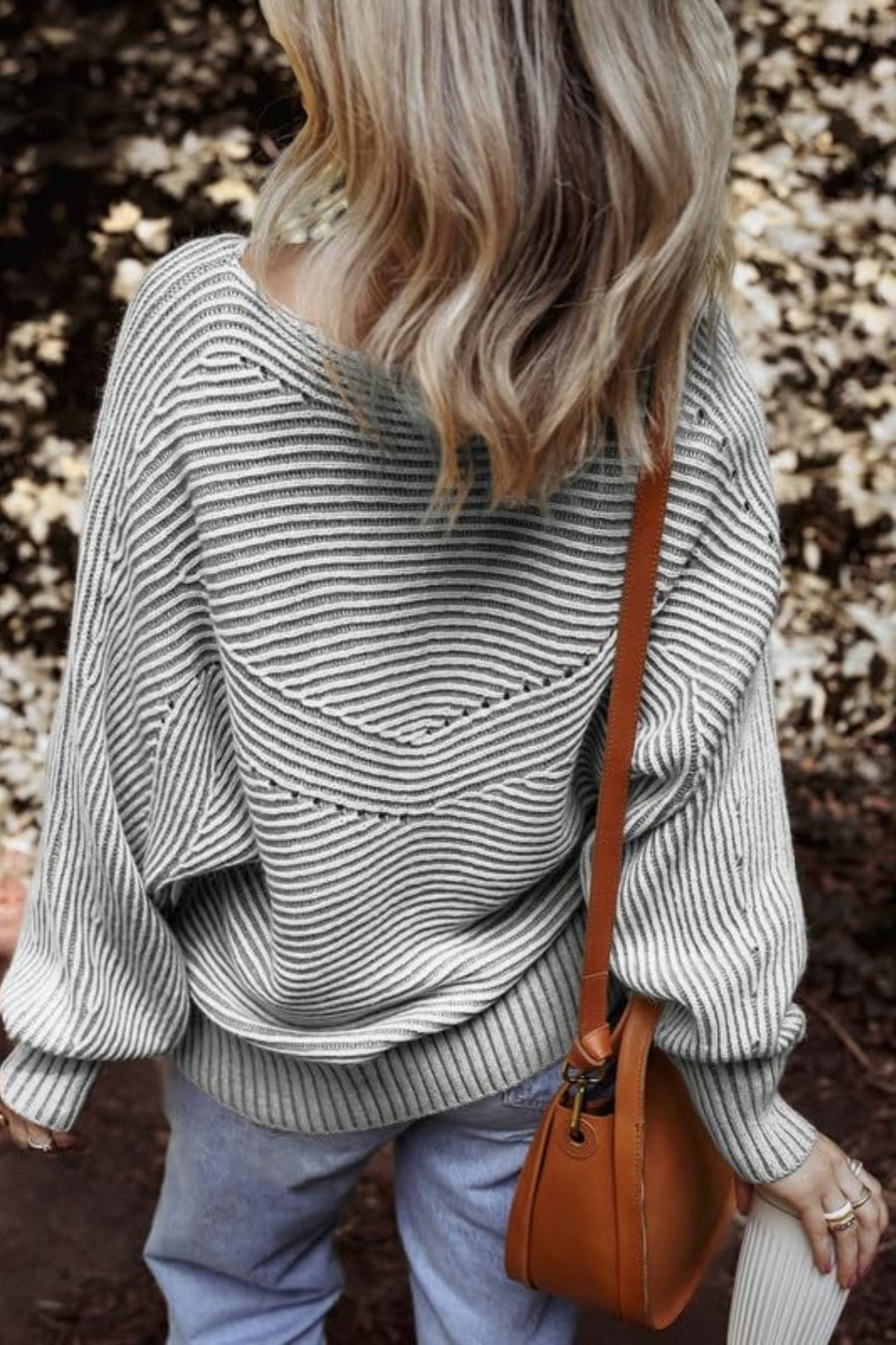 Gray textured stripe batwing knit sweater with a V-shaped yoke detail.