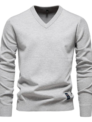 Gray ribbed knit V-neck sweater with long sleeves and a small logo tag detail.