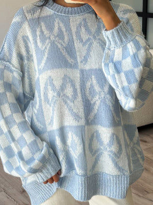 white pullover sweater featuring dropped shoulder and geometric