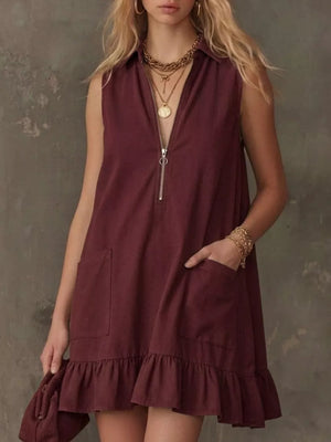 Burgundy zip-front collared dress with ruffle hem and pockets.
