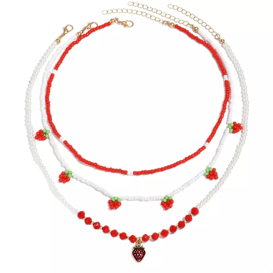 necklace in white with strawberry motif and beaded