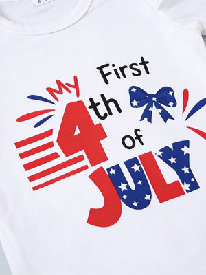 White baby one-piece with "My First 4th of July" graphic, featuring patriotic bow and flag details.