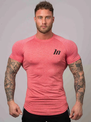 Burnt Coral raglan tee with black logo detail and short sleeves.