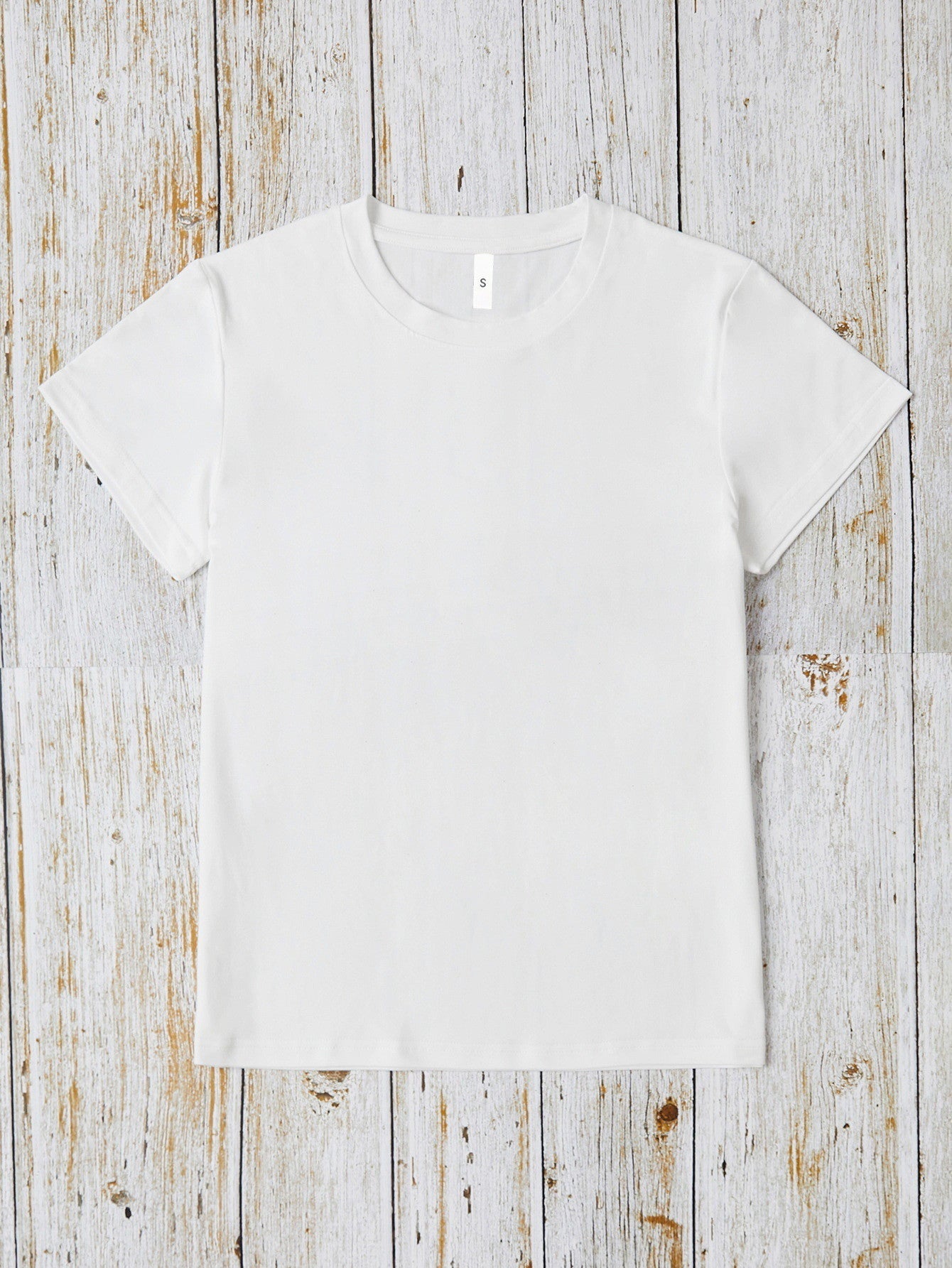 White oversized graphic tee with crew neck and short sleeves.