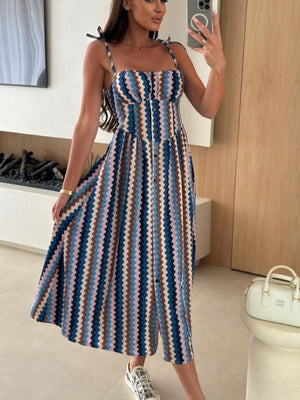 Tie-shoulder midi dress with a colorful zigzag pattern and adjustable straps.
