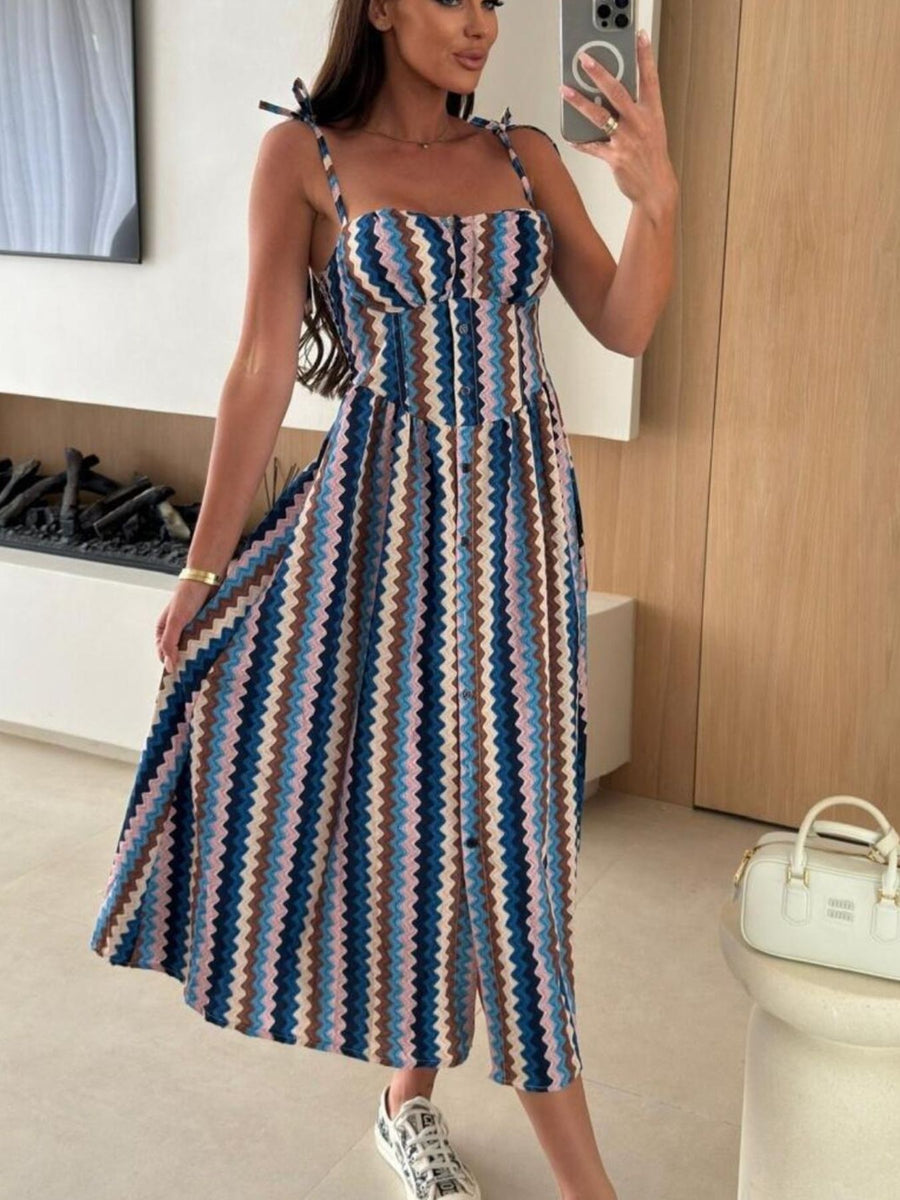 Tie-shoulder midi dress with a colorful zigzag pattern and adjustable straps.