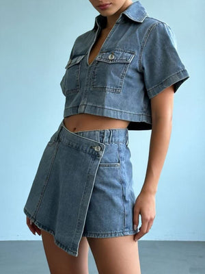 Light wash denim cropped button-down top and wrap mini skort set with pocket details.