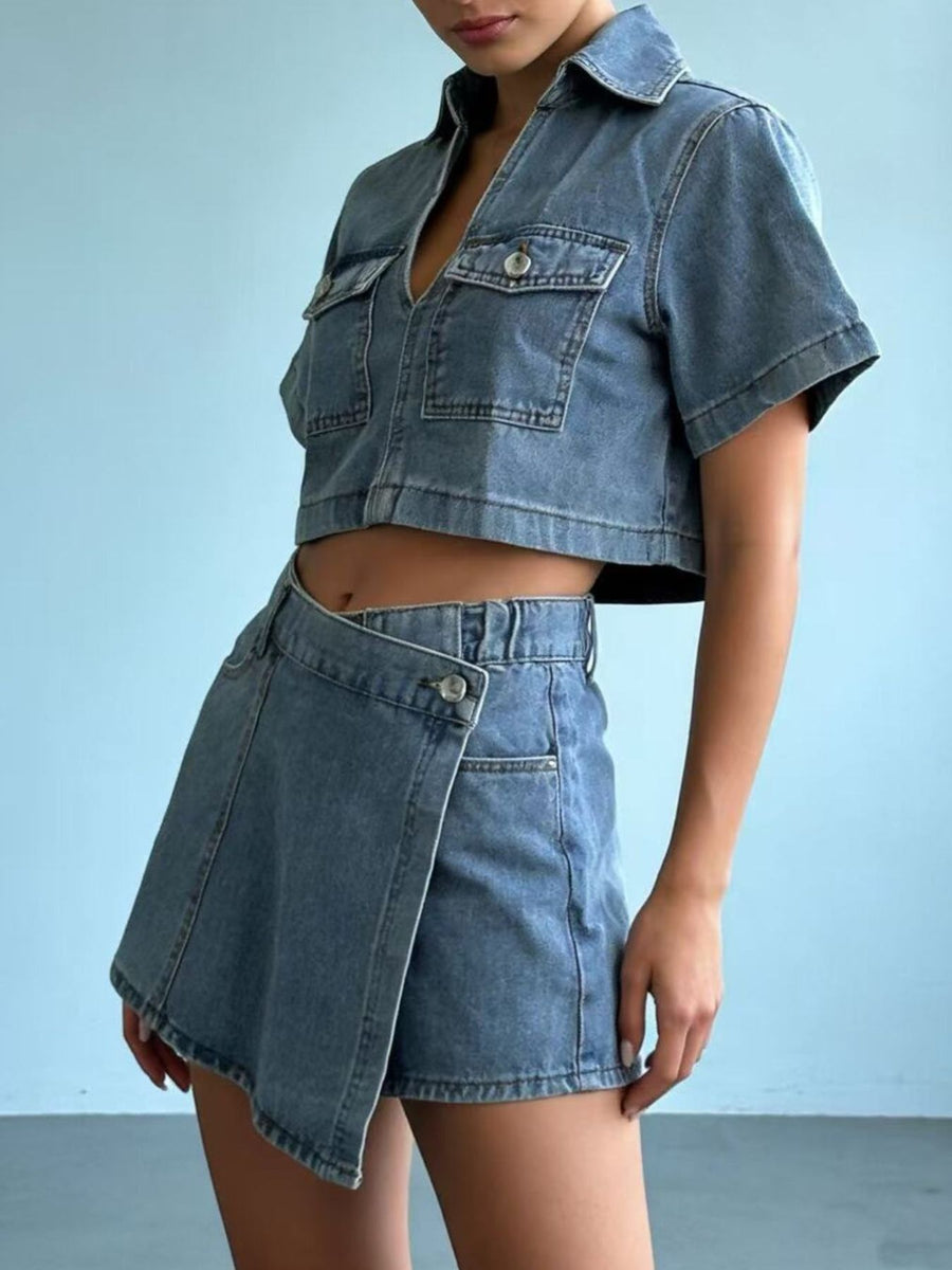 Light wash denim cropped button-down top and wrap mini skort set with pocket details.