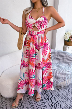 Tropical halter cutout maxi dress in beige with pink and orange floral print, featuring a tie front and side slit.