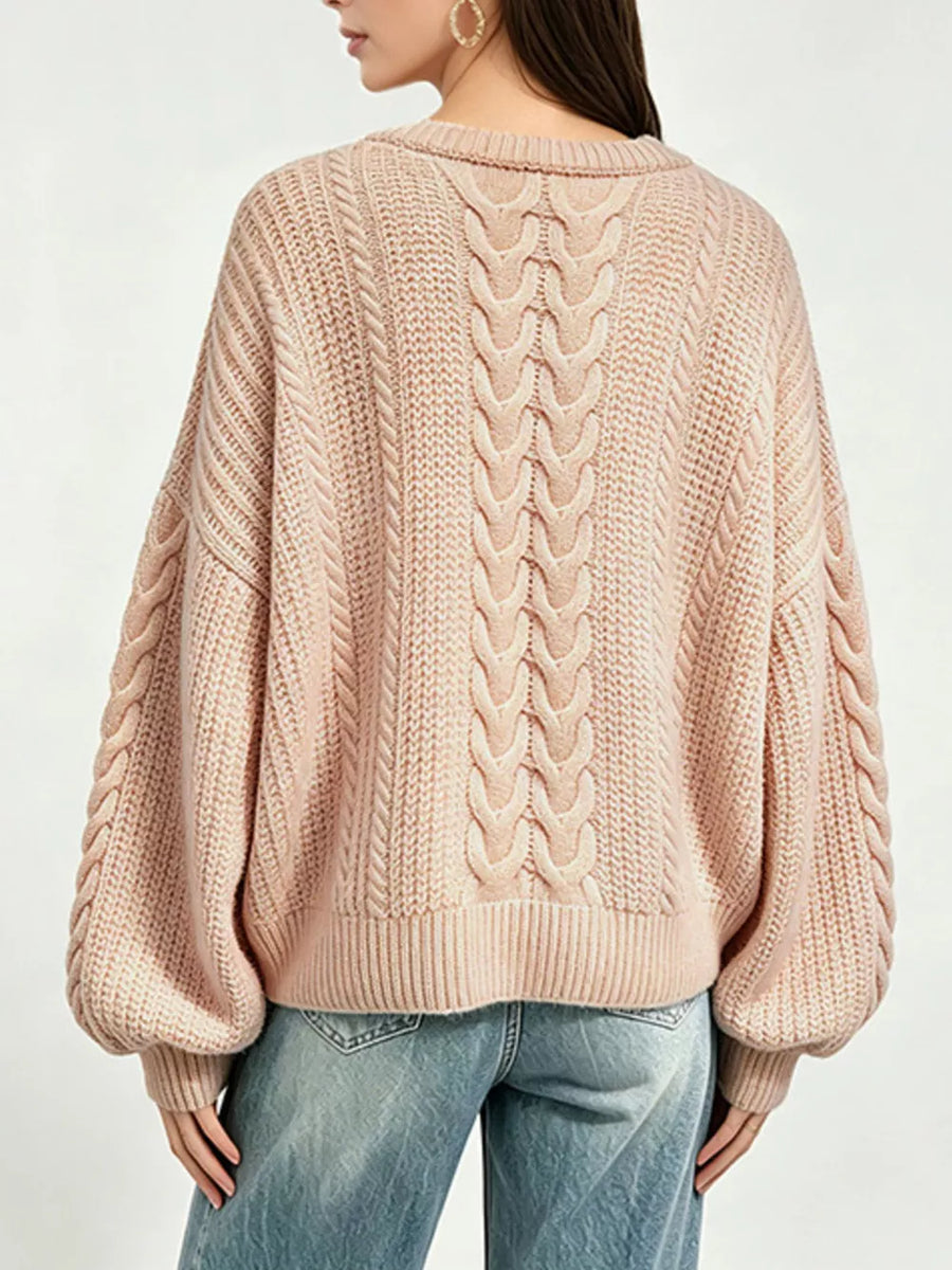 Beige pullover sweater featuring oversized and cable knit