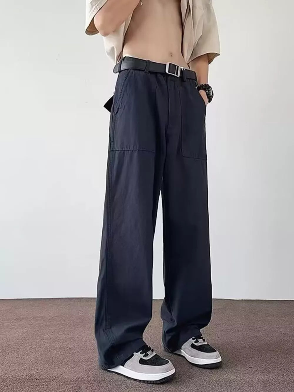 Navy blue casual wide-leg cargo pants with multiple pockets and a relaxed fit.
