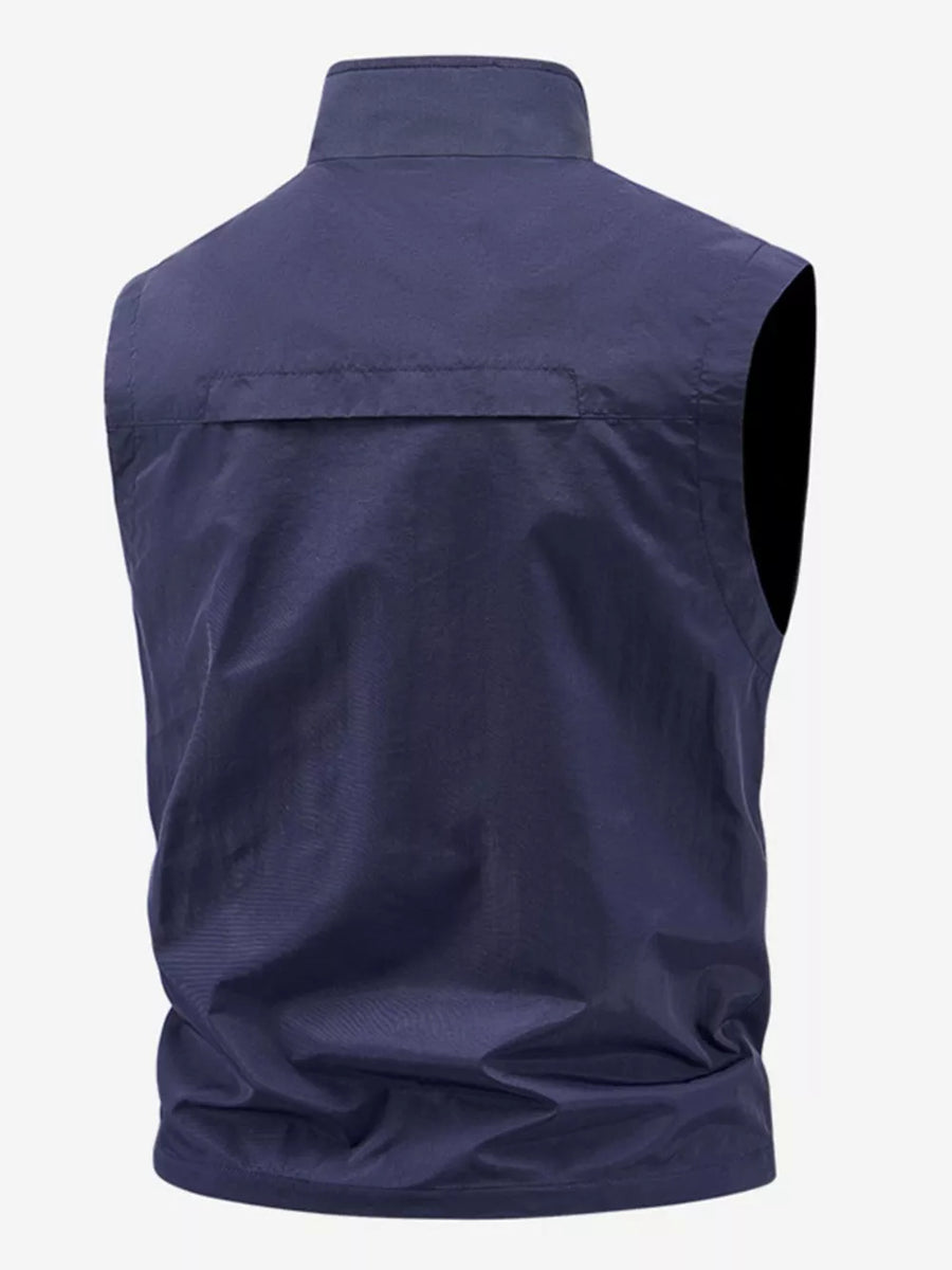 Dark blue men's outdoor vest with stand collar and back flap detail.