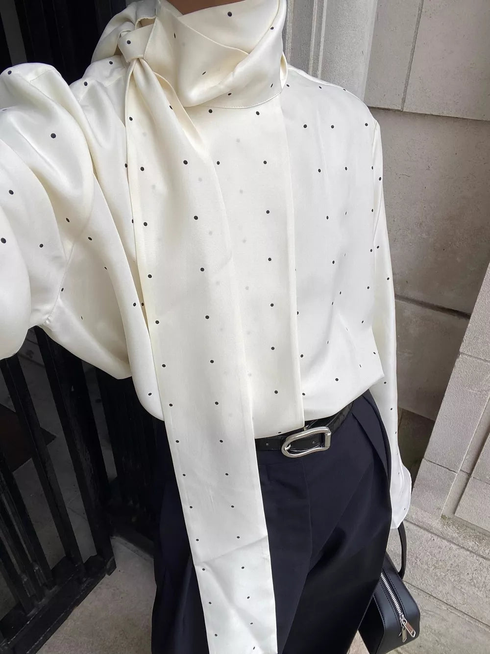 White blouse featuring scarf neck tie and polka dot
