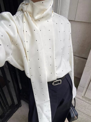 White blouse featuring scarf neck tie and polka dot