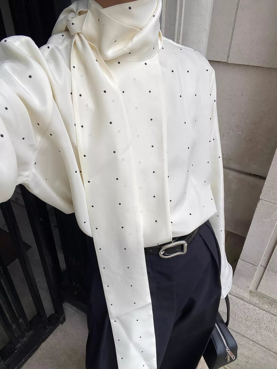 White blouse featuring scarf neck tie and polka dot