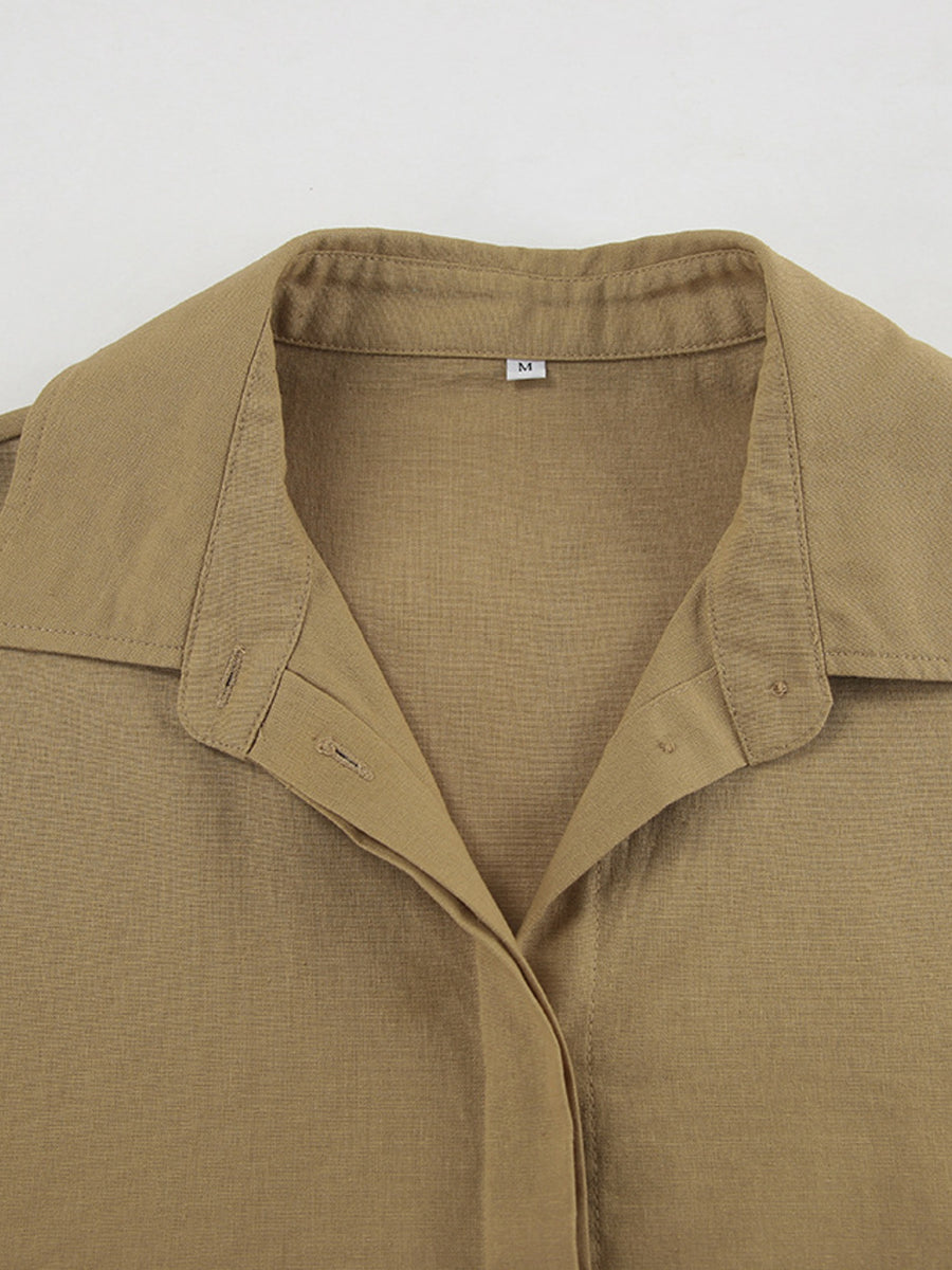 Cropped long sleeve top with collared neckline and button-up front in tan cotton.