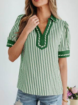 Collared split neck green and white striped blouse with bubble sleeves and contrast trim.