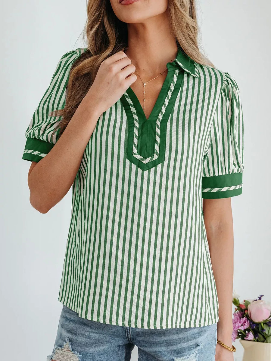 Collared split neck green and white striped blouse with bubble sleeves and contrast trim.