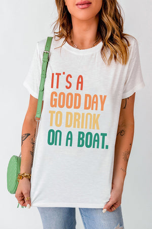 White graphic t-shirt with colorful text that says "IT'S A GOOD DAY TO DRINK ON A BOAT.